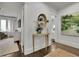 Elegant hallway with hardwood floors and large art piece at 115 17Th Ne St, Atlanta, GA 30309