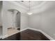 Bright dining room with dark hardwood floors and an archway at 3621 Vinings Slope Se # 1331, Atlanta, GA 30339