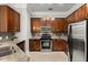 Modern kitchen with stainless steel appliances and granite countertops at 3621 Vinings Slope Se # 1331, Atlanta, GA 30339