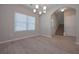 Bright dining room features hardwood floors and a chandelier at 371 Ajo Way, Dallas, GA 30157