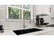 Modern kitchen sink with a sleek, black undermount sink at 1129 Victory Sw Dr, Atlanta, GA 30310