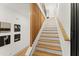 Modern staircase with light wood and metal accents at 1129 Victory Sw Dr, Atlanta, GA 30310