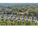 Aerial view of a neighborhood with many houses at 6235 Banyan Trl, Cumming, GA 30028