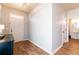 Entryway with hardwood floors, white door, and half bathroom at 92 Grampian Ct # 14, Marietta, GA 30008