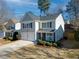 Two-story house with gray siding, white trim, and a two-car garage at 179 Wallnut Hall Cir, Woodstock, GA 30189