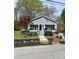 Charming gray house with a screened porch and well-maintained landscaping at 25 Johnson Rd, Atlanta, GA 30318
