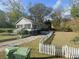 Cute bungalow with a white picket fence and spacious yard at 25 Johnson Rd, Atlanta, GA 30318
