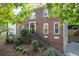 Brick two-story house with double doors, landscaping, and driveway at 2339 Milstead Cir, Marietta, GA 30066