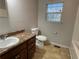Clean bathroom with a vanity, toilet, and bathtub at 309 Hemphill School Nw Rd, Atlanta, GA 30331