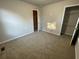 Bright bedroom featuring carpet and ample closet space at 309 Hemphill School Nw Rd, Atlanta, GA 30331