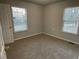 Well-lit bedroom with two windows and neutral decor at 309 Hemphill School Nw Rd, Atlanta, GA 30331