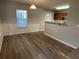 Bright dining area with wood-look flooring and built-in shelving at 309 Hemphill School Nw Rd, Atlanta, GA 30331