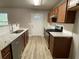 Modern kitchen with stainless steel appliances and wood cabinets at 309 Hemphill School Nw Rd, Atlanta, GA 30331