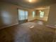 Spacious living room with carpeted floors and lots of natural light at 309 Hemphill School Nw Rd, Atlanta, GA 30331