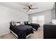 Bedroom with two twin beds and a ceiling fan at 510 Palmetto Oaks Trl, Palmetto, GA 30268