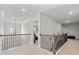 Upstairs hallway with carpet and iron railings at 510 Palmetto Oaks Trl, Palmetto, GA 30268