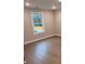 Simple bedroom with hardwood floors and a window at 2722 Byess Ct, Marietta, GA 30064