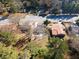 Aerial view of homes and yards near a roadway, showcasing property lines and landscaping at 4520 Lawrenceville Hwy, Tucker, GA 30084