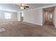 Open living room with neutral decor and carpet flooring at 4520 Lawrenceville Hwy, Tucker, GA 30084