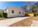 Side yard with long driveway and wooden fence at 4520 Lawrenceville Hwy, Tucker, GA 30084