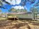 House exterior showcasing a light green color at 4050 Holly Springs Rd, Rockmart, GA 30153