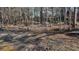 Wooded lakefront lot with small dock at 6460 Pine Ridge Cir, Cumming, GA 30041