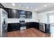 Modern kitchen with stainless steel appliances and granite countertops at 2169 Charcoal Ives Rd, Lawrenceville, GA 30045