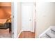 Clean hallway with hardwood floors and access to other rooms at 6161 Thorncrest Dr, Tucker, GA 30084