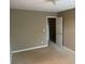 Simple carpeted bedroom with an adjoining room at 800 Crestside Ct # 800, Austell, GA 30168
