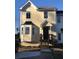 Cute yellow two-story house with a bay window and brown wooden steps at 800 Crestside Ct # 800, Austell, GA 30168