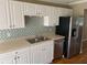 Kitchen with white cabinets and stainless steel appliances at 800 Crestside Ct # 800, Austell, GA 30168