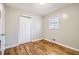 Well-lit bedroom featuring hardwood floors and closet at 1433 Sunnybrook Dr, Jonesboro, GA 30236