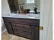 Bathroom featuring double vanity and dark wood cabinets at 5148 Pine Cliff Tarn, Acworth, GA 30102