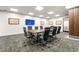 Conference room with a large table and comfortable seating at 620 Peachtree Ne St # 1810, Atlanta, GA 30308