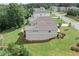 Rear view of house highlighting the deck and landscaping at 125 Registry Ln, Canton, GA 30115