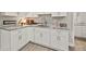 Basement kitchenette with white cabinets and granite countertops at 125 Registry Ln, Canton, GA 30115