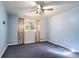 Blue bedroom with ceiling fan and wall-to-wall carpet at 809 Shadybrook Ne Dr, Marietta, GA 30066