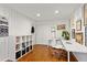 Bright home office with built-in shelving and hardwood floors at 1985 Kenwood Se Rd, Smyrna, GA 30082