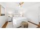 Well-lit bedroom with hardwood floors, ceiling fan, and neutral color palette at 996 Longleaf Dr, Forest Park, GA 30297