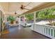 Spacious front porch with ceiling fans and wooden floors at 1930 Ridge Rd, Cumming, GA 30041