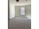 Bright bedroom with carpet and large window at 435 Price Quarters Rd, Mcdonough, GA 30253