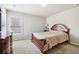 Spacious bedroom with wood flooring and large window at 615 Ceremony Way, Acworth, GA 30102