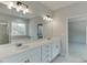 Elegant bathroom with double vanity and large mirror at 2594 Hickory Valley Dr, Snellville, GA 30078