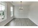 Dining room featuring gray flooring and a chandelier at 2594 Hickory Valley Dr, Snellville, GA 30078