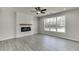 Living room with fireplace and large window at 2594 Hickory Valley Dr, Snellville, GA 30078