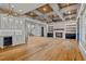 Spacious living room featuring hardwood floors, a fireplace, and built-in shelving at 4560 Oglethorpe Loop, Acworth, GA 30101