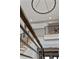 Elegant staircase with metal railing and modern chandelier at 4560 Oglethorpe Loop, Acworth, GA 30101