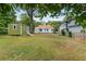 Spacious backyard with shed and large tree, offering ample outdoor space at 1010 S Mcdonough St, Decatur, GA 30030