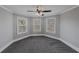 Bright bedroom with ceiling fan and carpet at 2450 China Berry Ln, Powder Springs, GA 30127