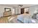 Bright bedroom with wood floors and barn door to en-suite bathroom at 2718 Pine Grove Ct, Austell, GA 30106